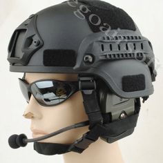 a helmet with goggles and sunglasses on top of a mannequin's head