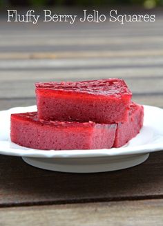 fuffly berry jello squares on a white plate with the title above it