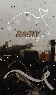 rain is falling down on the window and it says rainy