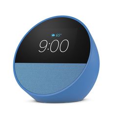 an alarm clock sitting on top of a blue and black speaker system with the time displayed