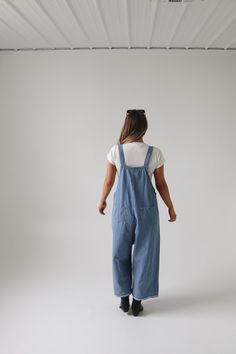 Frankie Denim Overalls are crafted from washed denim for a stylish, weathered look. Featuring an oversized and loose fit with adjustable straps and distressed details, these overalls are designed to provide a comfortable, personalized fit. Model Measurements: Hips 34” Waist 25” Bust 32” Height 5’6.5, wearing a size small Material: 100 Cotton Measurements XS: Hips: 42"| Length: 44" (taken from top of front of overalls to ankle cuff) S: Hips: 42"| Length: 44.5" (taken from top of front of overalls Utility Style Washed Denim Jumpsuit, Relaxed Fit Medium Wash Overalls With Adjustable Straps, Everyday Bib Front Overalls With Pockets, Washed Blue Cotton Utility Denim Jumpsuit, Everyday Dark Wash Overalls With Pockets, Medium Wash Relaxed Fit Denim Utility Jumpsuit, Cotton Relaxed Fit Shortalls With Adjustable Straps, Relaxed Fit Dark Wash Shortalls With Pockets, Dark Wash Relaxed Fit Shortalls With Pockets