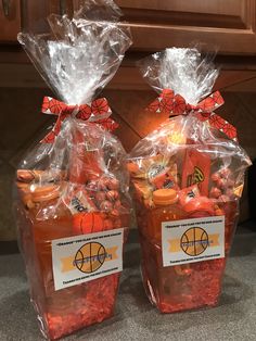 two bags filled with candy sitting on top of a counter