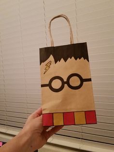 someone is holding up a harry potter goodie bag