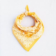 a yellow bandana on a white background