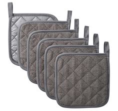 five oven mitts are lined up on a white background and one has a gray quilted design