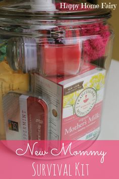 the new mommy survival kit is in a glass jar with pink flowers and other items