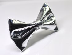 Welcome to OsunWorld! Item: Silver Grey Gray Faux Leather Bow tie Condition: Brand New- Hand Made Color: Silver  Material: Faux Leather -Shining Size        Bow tie Fits 0-12 months:width 4.5cm*Length 8cm 【Adjustable strap】        Bow tie Fits 1-6 Years Old: width 5cm*Length 9cm 【Adjustable strap】 Bow Tie Fits 7-14 Years Old width 5.5cm* Length 10.5cm【Adjustable strap】         Bow tie Fits Adult Width 6.5cm*Length 12cm 【Adjustable strap】 Package: 1 Bow tie Due to the use of flash photography and monitor difference, there may be slight or no color variation of item described   Due to the use of flash photography and monitor difference, there may be slight or no color variation of item described   Payment Payments options: ETSY PAYMENT   Shipping  We are located in Perth, Australia.  Regular Pvc Bow, Silver Bow Tie, Leather Bow Tie, Silver Bow, Flash Photography, Teenage Boys, Leather Bows, Make Color, Tie Accessories