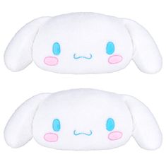 two white stuffed animals with blue eyes and pink ears, one has an angry look on its face