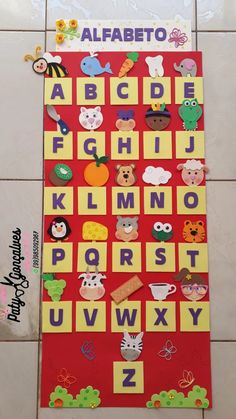 a red board with letters and animals on it