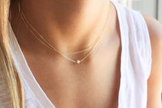 "Ultra Dainty Necklace, Necklaces for Women, Pearl & Gold Necklace Set of Two This Ultra Dainty Layered Necklace set of two necklaces is wonderful for everyday wear and for special occasions. A perfect way to wear layers with a minimal look and a touch of sparkle. D E T A I L S -Two separate chains to wear together or alone -Plain delicate chain -Tiny freshwater pearl wrapped by hand -14kt Gold-Filled or sterling silver high quality delicate link chain LENGTH - Please select from the drop do Dainty Wedding Necklace, Simple Delicate Chain Jewelry For Wedding, Minimalist White Double Strand Necklaces, Dainty Delicate Chain Layered Necklace For Wedding, Delicate Layered Necklace With Delicate Chain For Wedding, Dainty Layered Necklace For Wedding With Delicate Chain, Delicate Layered Necklace With Chain For Wedding, Delicate Double Strand Necklace For Wedding, Dainty Layered Necklace For Wedding