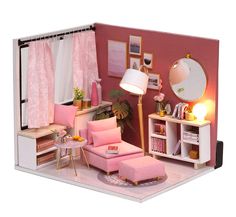 a doll house is shown with furniture and accessories in it's display area, including a pink couch