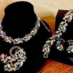 This Vintage Jewelry Set By Sarah Coventry Is A Stunning Piece From The 1950s.The Set Is In Pristine Condition - Hard To Find A Set Of This Quality In Such Fine Shape. The Full Set Features A Brooch, Necklace, Bracelet And Earrings With Sapphire Blue Insets And Champagne-Colored Rhinestones In A Marquise Shape. It Is In Its Original And Authentic Condition, And Is A Beautiful Addition To Any Fashion Jewelry Collection. The Metal Is Silver Tone. All Stones Are Present, Intact And Brilliant. It Is Signed By Sarah Coventry And Was Manufactured In The United States. We Offer 3 Types Of Jewelry - Collectible Vintage Jewelry, "Reinvented Vintage", And Handcrafted Wire Wrapped Creations. Col Sarah Coventry Jewelry Vintage, Princess Pirate, Blue Champagne, Types Of Jewelry, Sarah Coventry Jewelry, Vintage Jewelry Sets, Brooch Necklace, Sarah Coventry, Sapphire Blue