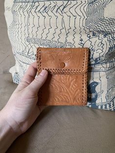 1980’s light brown tooled leather wallet. Very simple, just one interior strap for cash or notes Brown Hand-tooled Wallets For Everyday Use, Brown Vintage Coin Purse With Interior Card Slots, Brown Embossed Wallet For Everyday Use, Tooled Leather Wallet, Beaded Evening Bags, Top Handle Handbags, Tooled Leather, Evening Clutch Bag, Flower Basket