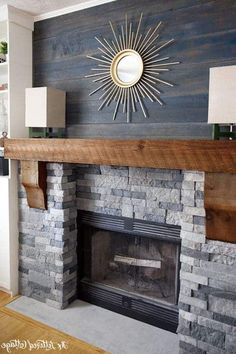 a living room with a fire place and a mirror on the wall above it's mantle