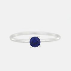 This is a beautiful Sapphire ring. It is set in real solid 14Kt Gold. You can choose if you want 14Kt White Gold, 14Kt Yellow Gold or 14Kt Rose Gold. This is the perfect gift for mom, wife, fiancee, girlfriend, valentine, daughter, family or friend. It is a special gift for mother's day, valentine's day, wedding, anniversary, birthday, Christmas, Easter, New Year's and any holiday. 4mm Created Blue Sapphire Metal Weight: 0.91 Grams 1.25mm ring width Comes in jewelry box MATCHING NECKLACE, EARRIN Classic Crystal Ring With Birthstone In Round Cut, Classic Crystal Birthstone Ring With Round Cut, Classic Round Crystal Birthstone Ring, Classic White Gold Crystal Ring With Birthstone, Classic Stackable Sapphire Ring, Classic Everyday Sterling Silver Birthstone Ring, Classic 14k White Gold Birthstone Ring With Round Band, Minimalist White Gold Sapphire Promise Ring, Classic Everyday Birthstone Rings