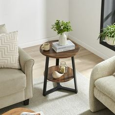 a living room with two couches and a table in the middle of the room