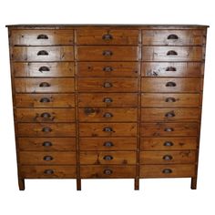 an old wooden dresser with many drawers