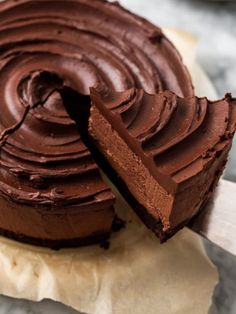 a chocolate cake with one slice missing from it