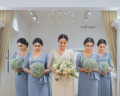 the bride and her bridesmaids are holding bouquets