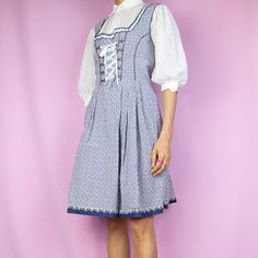 The Vintage Y2K Plaid Lace Up Corset Dress is a vintage 2000s navy blue and white checkered floral sleeveless mini dress with corset-style laced front and side zipper closure. The white blouse shown underneath is not included. ESTIMATED SIZE L TAG SIZE EUR 44 MEASUREMENTS Length 95cm - 37.40 inch Chest 98cm - 38.58 inch Waist 84cm - 33.07 inch Our model is 172 cm tall and usually wears size XS. Please note that items may be slightly pinned on model to show correct fit. We ship worldwide from Spa Style Corset, Dress With Corset, Check Dress, Vintage Plaid, Corset Style, Floral Sleeveless, Sleeveless Mini Dress, Dress Lace, White Blouse