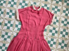 "Stunning bright pink, soft and lightweight dress with white angora fur trim collar and cuffs. In very good condition with some light wear to the collar and some light wear to one of the buttons along the waist line. Underarm to Underarm: 18\" Natural Waist, across: 14.5\" Drop Waist, across: 17\" Length of Upper Portion: 20.5\" Length of Lower Portion: 17.5\" Overall Length: 38 Please ask any questions before purchasing, especially concerning fit or condition. All items are vintage and in condi Pink Retro Dress With Peter Pan Collar, Retro Pink Collared Dress, 1950s Pink Vintage Dress With Short Sleeves, Vintage Pink Collared Dress, Pink Vintage Collared Dress, 1960s Barbie, Batwing Blouse, Bubble Gum Pink, Glory Days