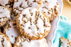 a plate full of iced cookies with icing