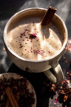 a cup of hot chocolate with cinnamon and star anise