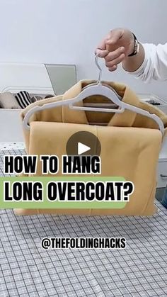 a man is holding a bag with the words how to hang long overcoat?