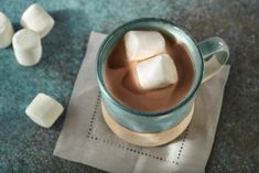 a cup of hot chocolate with marshmallows on the side