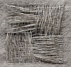 an abstract black and white image of woven fabric with lines in the center, on a gray background