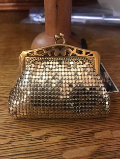 Vintage Witting and Davis , gold mesh coin purse, made in USA. This small coin purse is in amazing condition for its age. It may have never been used. There is no evidence that it has. The interior lining is clean and pristine. The outside mesh is impeccable. The kissing closure mechanism works  perfectly. All original and in mint condition. It is small....measures 3 x 2 1/2 Circa: 1950's Vintage Coin Purse For Travel, Elegant Gold Wallet With Coin Pocket, Compact Gold Wallet For Everyday Use, Vintage Pouch Coin Purse For Party, Vintage Gold Clutch For Everyday Use, Compact Gold Wallet For Formal Occasions, Formal Gold Compact Wallet, Formal Compact Gold Wallet, Vintage Gold Coin Purse For Party