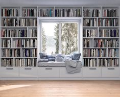 a room filled with lots of books and furniture