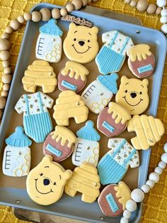 baby shower cookies are arranged in the shape of teddy bears and other items on a tray