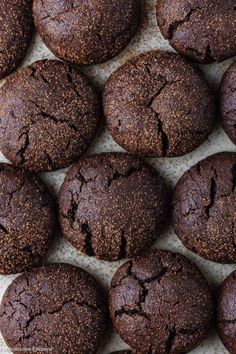 chocolate cookies are lined up on a table