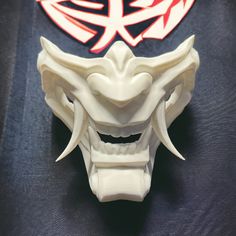 Majin Mempo Mask - 3D Printed Décor, Costume, Cosplay Immerse yourself in the world of Japanese folklore with our Majin Mempo Mask. Inspired by traditional Noh and Samurai designs, this mask embodies the essence of mystical beings. Majin masks are often associated with supernatural powers and have a rich history in Japanese culture. Now, you have the opportunity to bring this captivating tradition to life through your own artistic expression. Whether you're a cosplayer, collector, or simply pass Mempo Mask, Japanese Noh Mask, Mystical Beings, Supernatural Powers, Kitsune Mask, Japanese Folklore, Half Mask, Biodegradable Plastic, Costume Mask