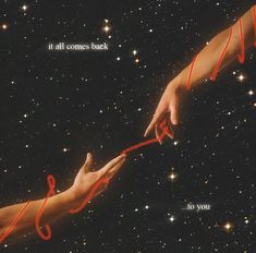 two hands reaching out towards each other with red string attached to them and stars in the background