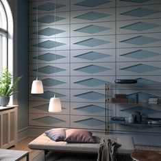 a living room with a couch, lamp and book shelf on the wall next to a window