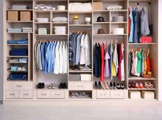 an organized closet with clothes and shoes