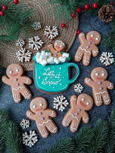 gingerbreads and hot chocolate are arranged in the shape of mugs