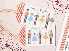 two christmas cards with an image of nutcrackers and soldiers on them next to some confetti