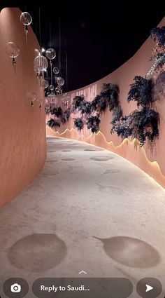 an image of a room that looks like it is made out of sand and has plants growing on the walls