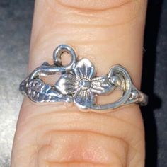 You’re Purchasing A 1x Flower Leaf Aesthetic Ring Design Size 7.50 Sterling Silver 1.3 Grams For Adults/Teens Unisex Pre-Owned 10/10 Good Conditions Heavy Wedding Vintage Collectible Limited Exclusive Available! Ask Me Anythig Open To Offers! Adjustable Silver Vintage Midi Rings, Vintage Silver Toe Ring With Flower Design, Delicate Silver Ring For Spring, Silver Open Flower Ring For Spring, Vintage Rings For Spring Gift, Vintage Flower Ring For Spring Gift, Silver Sterling Silver Flower Ring For Spring, Silver Promise Rings For Spring, Spring Sterling Silver Flower Ring In Silver