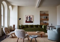 a living room filled with furniture and windows