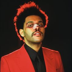 a man in a red suit with an injured eye patch on his forehead and nose