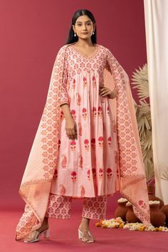 Old rose pink anarkali with paisley, floral block print and gota work neckline. Paired with printed palazzo and printed dupatta.
Component: 3
Pattern: Printed
Type Of Work: Block Print
Neckline: V Neck
Sleeve Type: Three Quarter
Fabric: Anarkali and Palazzo: Cotton Cambric, Dupatta: Cotton Mulmul
Color: Pink
Other Details: 
Printed palazzo
Gathered detail
Occasion: Puja - Aza Fashions Designer Pink Salwar Kameez With Printed Motifs, Pink Salwar Kameez With Printed Motifs, Pink Sharara With Printed Motifs And Traditional Drape, Traditional Pink Sharara With Printed Motifs, Bollywood Style Pink Cotton Palazzo Set, Pink Cotton Anarkali Set For Festivals, Pink Cotton Palazzo Set For Festivals, Pink Bollywood Style Kurta For Festivals, Wedding Mulmul Dupatta With Block Print