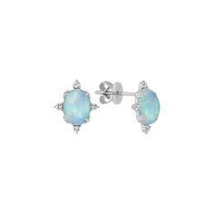 These beautiful earrings feature two of the highest quality natural Ethiopian opals. These lovely earrings are secured with friction backs make the perfect complement to any outfit. Each oval opal is set into quality 14 karat white gold and measures approximately 8mm in length. The opals are accented by eight round diamonds  at approximately .11 carat total weight. Opal should be cleaned gently with mild detergent in warm water and a soft toothbrush or cloth. Avoid bleach  chemicals and cleaners White Opal Earrings, Opal Stud Earrings, Wardrobe Accessories, Halo Earrings, Opal Earrings Stud, Platinum Jewelry, Opal Studs, Soft Toothbrush, Shiny Things