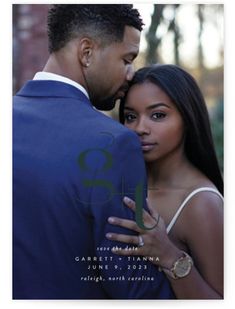 a man and woman embracing each other in front of trees with the word love written on it