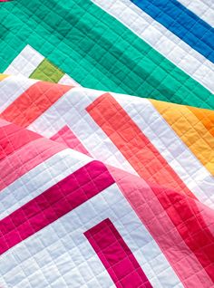 The Zoe Quilt Pattern is a quick, fun project for showing off your favorite fabrics. The pattern works beautifully with a selection of rainbow fabrics, but is also great for working from your stash or using your favorite fabric collection. SizesBaby Size - 45" x 45"Lap Size - 56" x 67"Twin Size - 79" x 90" Skill LevelIntermediate - the trickiest part of this pattern is trimming your quilt. Coloring SheetA coloring sheet for planning your fabrics can be downloaded here. A paper version of the pat Modern Geometric Quilt, Twin Quilt Pattern, Modern Quilt Blocks, Modern Baby Quilt, Spring Quilts, Scrappy Quilt Patterns