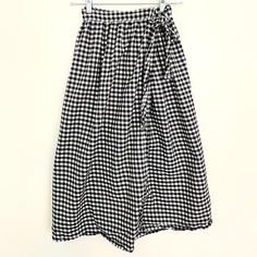 This is a lovely, light, size-inclusive wrap skirt, hand-made with 100% cotton. This is the perfect skirt for hot summer days and can be dressed up or down. Personally, I like to wear shorts while I bike to work in the summer, and then I throw this skirt on over the top. It's comfortable and stylish and has a lovely silhouette. Casual Gingham Gathered Skirt, Gingham Gathered Skirt Bottoms For Spring, Gingham Gathered Skirt For Spring, Summer Lined Skirt For Picnic, Spring Gingham Gathered Skirt Bottoms, Cotton Midi Wrap Skirt With Lining, Summer Tiered Skirt For Picnic, Cotton Wrap Skirt With Gathered Detail, Summer Picnic Lined Skirt