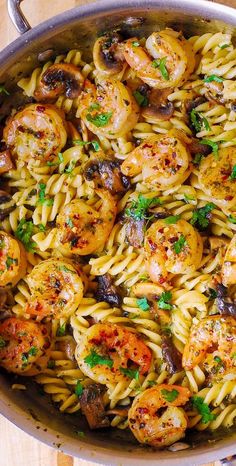 pasta with shrimp and mushrooms in a pan